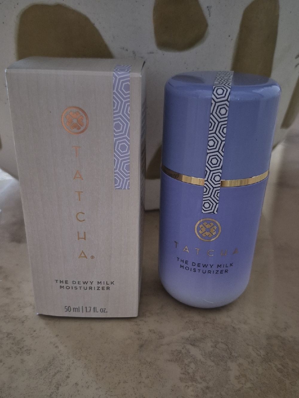 Tatcha Dewy Milk Moisturizer - Lavender Bottle with Gold Accents